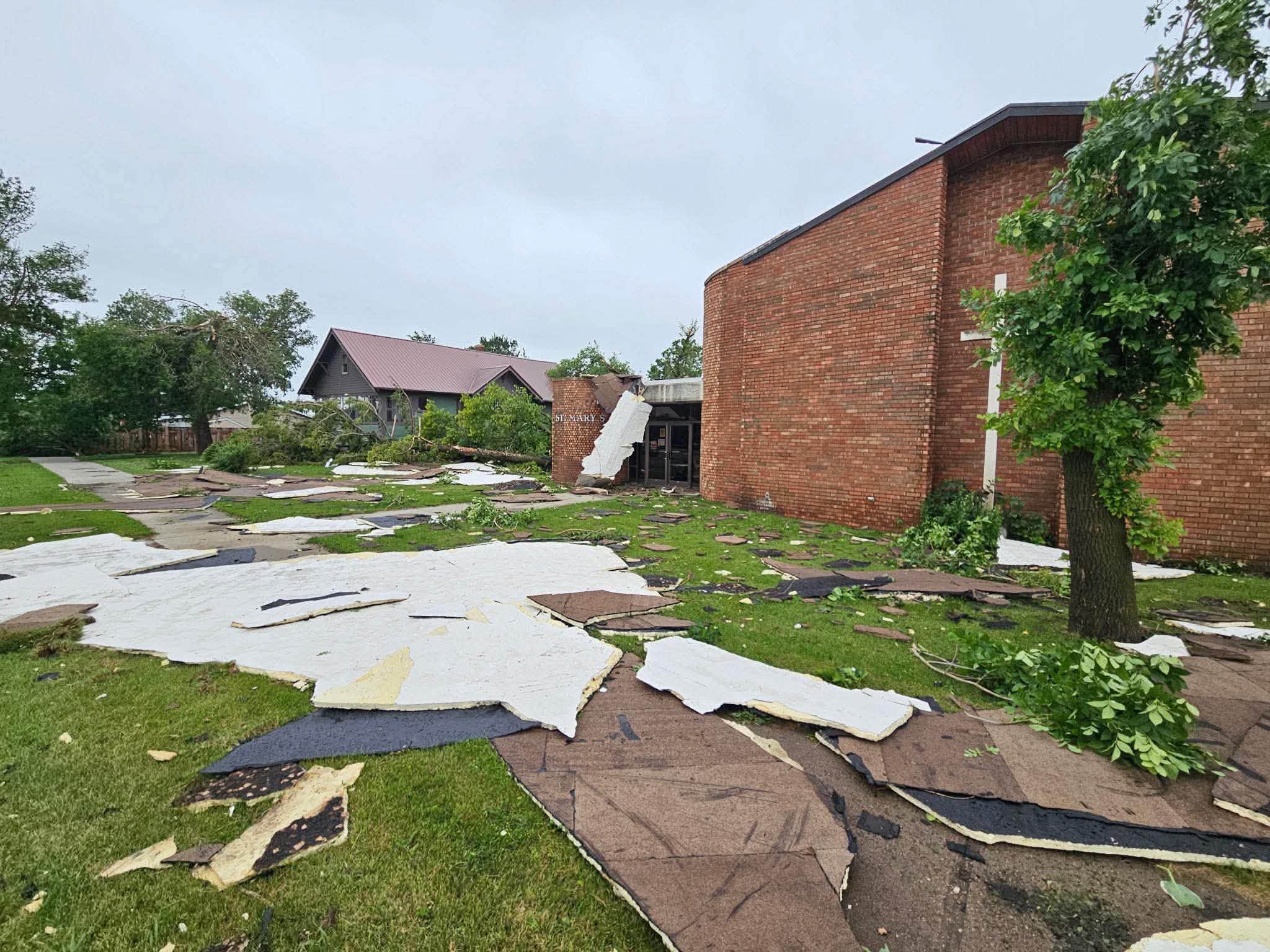 The exterior of St. Mary's Church and surrounding storm debris after the roof was damaged
